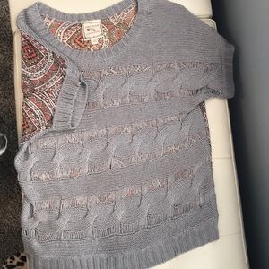 Grey and salmon patterned festive top.